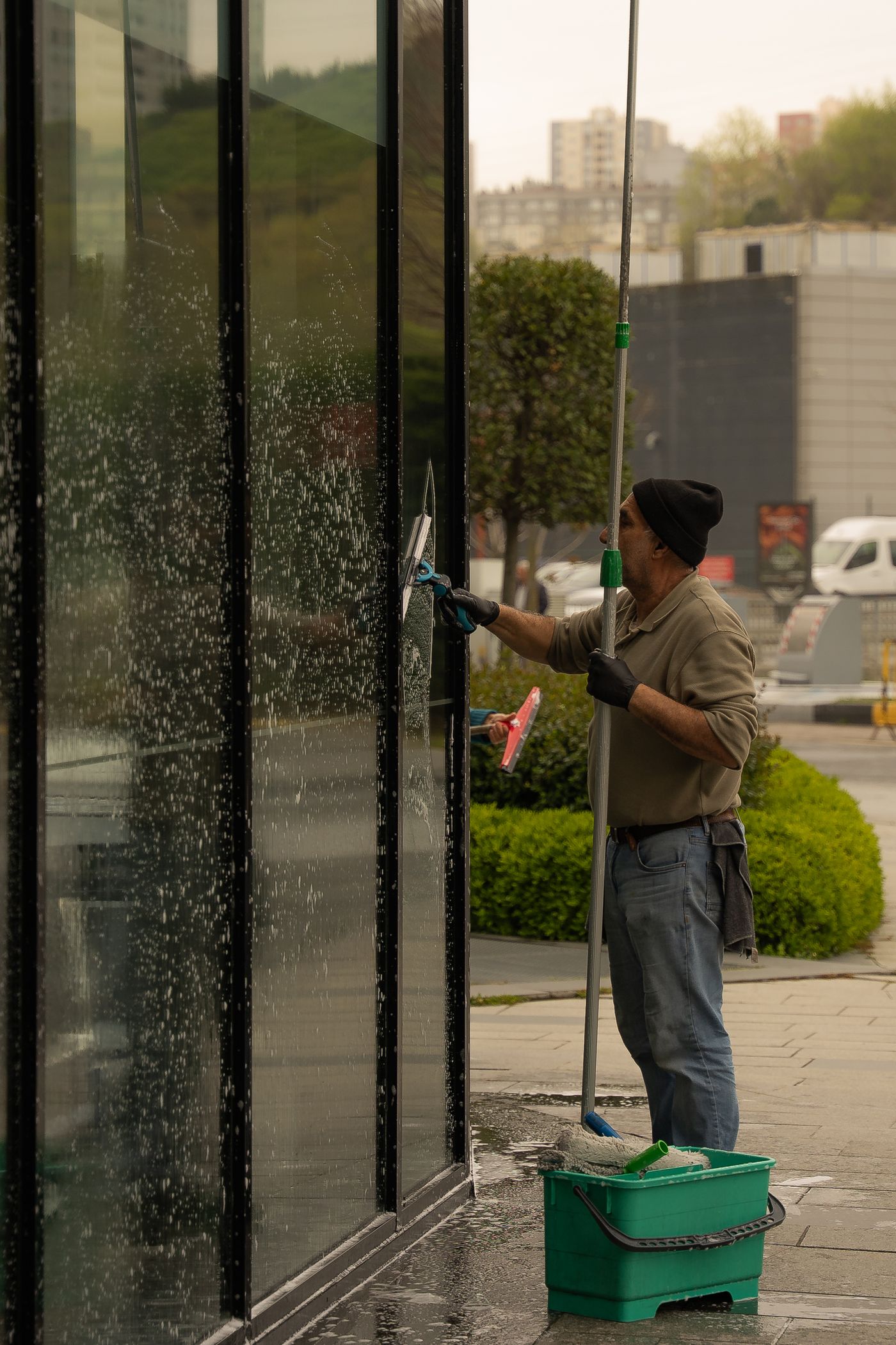 Professional cleaning an exterior window