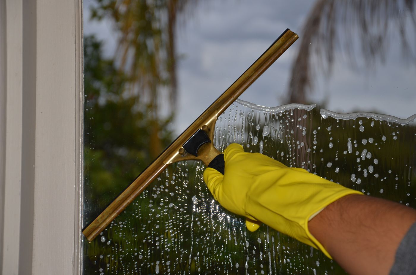Close-up window cleaning with a squeegee